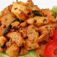 Chicken 65 · A classic South Indian dish of boneless deep-fried chicken pieces tossed in a spiced yogurt ...