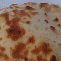 Naan · An Indian yeast- leavened bread baked in a clay oven.
