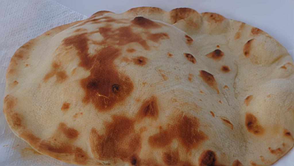 Naan · An Indian yeast- leavened bread baked in a clay oven.