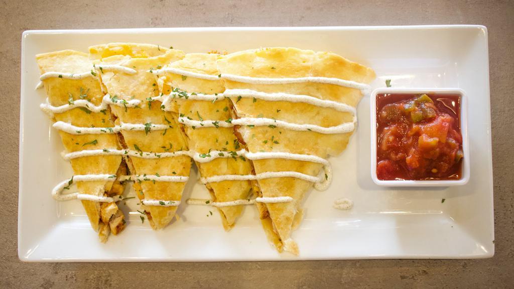 Quesadilla  · Grilled chicken, colby jack cheese and bacon in a flour tortilla, served with salsa and sour cream.