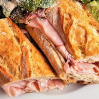 Brie & Ham · French style ham and brie served on a buttered crusty baguette.