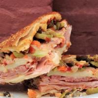 Hot Muffaletta · A twist on the NOLA classic: Ham, salami, chorizo, provolone cheese, house-made olive salad....