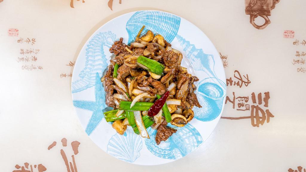 Mongolian Beef · Sliced tenderloin beef stir fried with green onions and jumbo onions.
