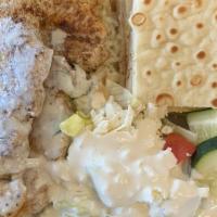 Chicken Kabob · Two skewers of grilled chicken tenders.
rice .salad .pita