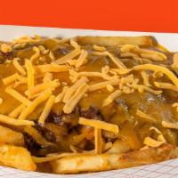 Chili Cheese Fries · Our battered fries topped with Texas style chili and shredded cheddar.