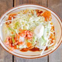 Enchiladas Supremas · Four  enchiladas,  one  ground  beef,  one  chicken,  one  bean  and  one  cheese  topped  w...