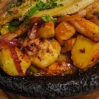 Molcajete De Mariscos · Grilled  fish,  shrimp  with  head  and  no  head,  clams  and  mini  scallops,  seasoned  w...