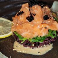 Hawaiian-Style Salmon Poke · Forbidden sushi rice, seaweed salad and mix sesame seed with salmon poke and caviar.