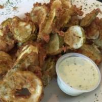 Fried Pickle Chips · Fresh pickles floured and fried to a crisp. served with our fresh made ranch.