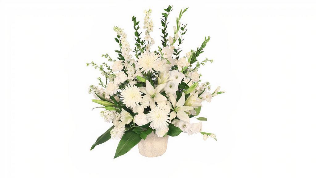 Graceful Devotion Designers Choice Arrangement · Send comfort and compassion in remembrance of a lost loved one with the Graceful Devotion memorial arrangement. The Graceful Devotion memorial arrangement would be a beautiful addition to any funeral service or wake, or sent to the home for a more personal sentiment.