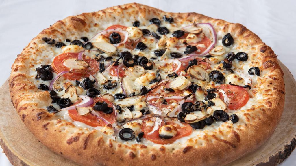 Greek Italian Pizza · Olive oil, feta, onion, black olives, tomatoes, fresh garlic, oregano, and dry basil.
