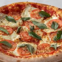 Margherita Pizza · Extra thin crust: fresh garlic, sliced tomatoes, fresh basil, mozzarella cheese.