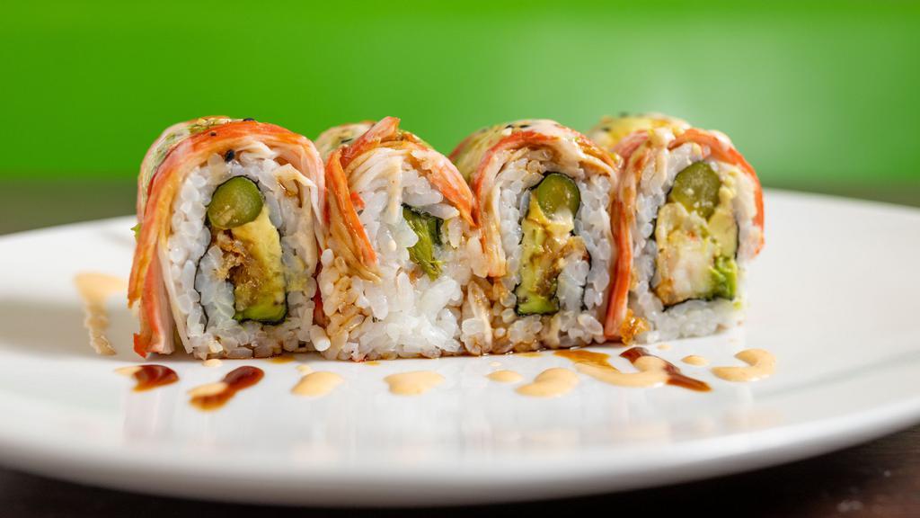 Midnight Roll · I/O shrimp tempura, avocado, asparagus topped with crab stick and spicy mayo.