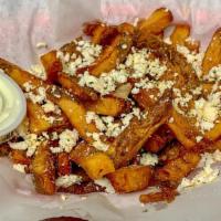 Feta Fries · House fries topped with feta crumbles & our blend of garlic & herb. (tzatziki included).