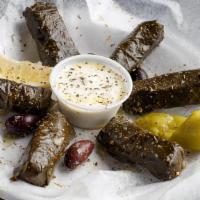 Stuffed Grape Leaves · Vegan. (6) Cooked rice, vine leaves, onions, dill, spearmint, black pepper, olive oil, and h...