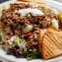 Gyro Salad · Gyro meat(lamb & beef) and tzatziki sauce atop fresh garden greens. W/tomatoes, red onions, ...