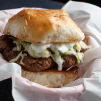American Burger · (9 oz.) Beef patty, lettuce, tomato, red onion, and homemade tzatziki sauce on a toasted spe...