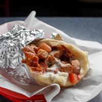 Mesquite Turkey Melt Specialty Gyro · Smoked mesquite turkey. Dressed with melted mozzarella and feta cheese, grilled red onion, t...