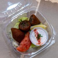 Fried Kibbeh · Fried cracked wheat stuffed with ground beef, onions, pine nuts, and fried. Served with Grec...