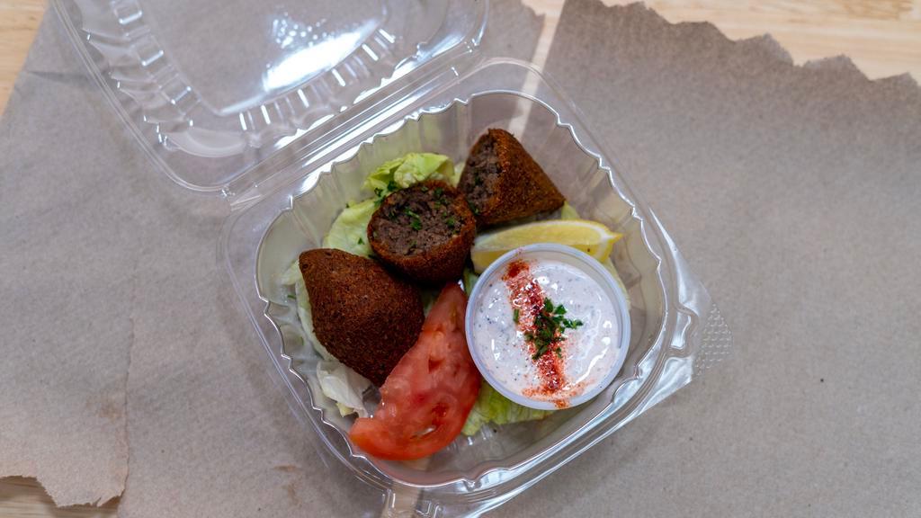Fried Kibbeh · Fried cracked wheat stuffed with ground beef, onions, pine nuts, and fried. Served with Grecian dip.