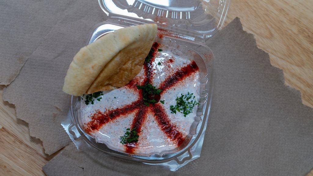 Grecian Dip · Served with two pieces of pita.