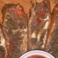 Philly Cheesesteak Egg Rolls · Beefsteak, melted cheese, onions, mushrooms & bell peppers 2 per order.