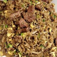 Arroz Chaufa De Carne · Beef Peruvian style fried rice with green onions, scrambled eggs, and soy sauce.