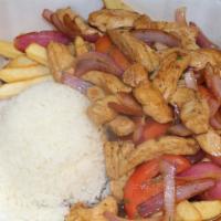 Saltado De Pollo · Peruvian style chicken stir-fry mixed with onions, tomatoes, cilantro, soy sauce, and served...