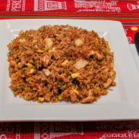 Arroz Chaufa De Pollo · Peruvian style chicken fried rice with green onions, scrambled eggs, and soy sauce.