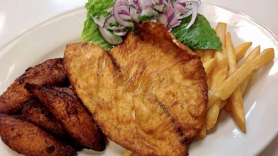 Pescado Frito De Tilapia  · Fried Tilapia fillet served with two sides of your choice.