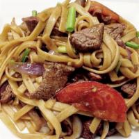 Tallarin Lomo Saltado · Open flame sautéed beef strips, with onions and tomatoes, soy sauce and mixed with noodle.