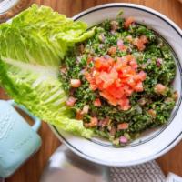 Tabouli · A delicate mixture of parsley, onions, cracked wheat, and tomatoes seasoned with extra virgi...