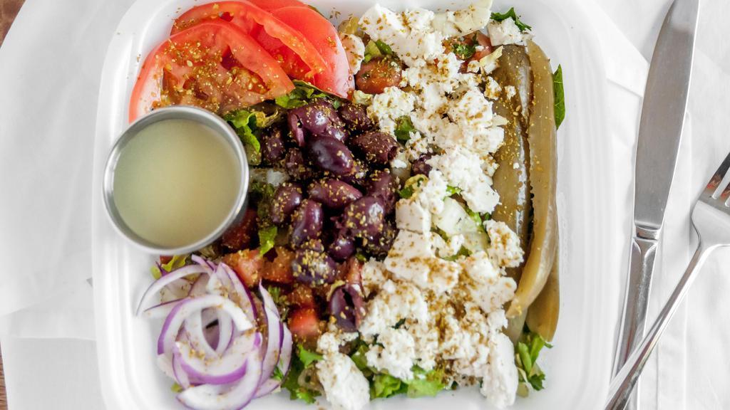 Greek Salad · Tomatoes, sliced cucumbers, green bell peppers, red onion, sliced, or cubed feta cheese and kalamata olives, typically seasoned with salt, pepper, and dried oregano and dressed with olive oil.