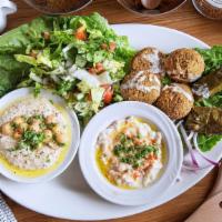 Vegetarian Combo · Hommos, salad, baba ghanoush, falafel, and grape leaves.