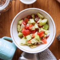 Lebanon Salad · Tomato, cucumber, and onion mixed with parsley and combined with the juice of freshly squeez...