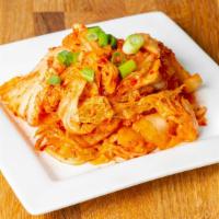Kimchi · Locally made with cabbage, garlic, ginger, fish sauce, red pepper flakes, and radish.
