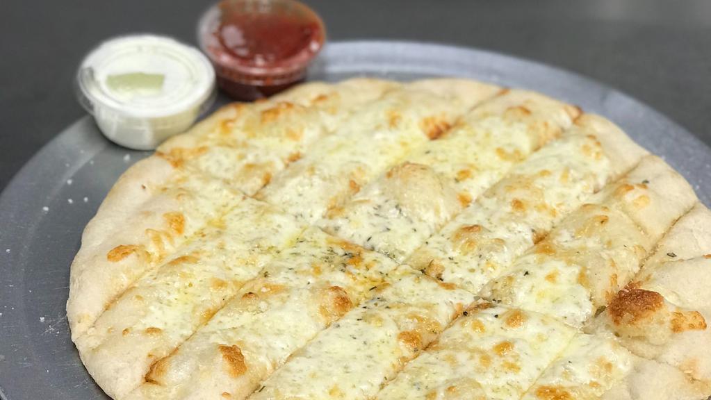 Cheesy Breadsticks · HUGE ORDER OF Baked pizza dough, topped with mozzarella, and garlic butter served with marinara and ranch.
