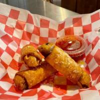 Philly Cheesesteak Eggrolls · Thinly Sliced Steak, Cheese and Onion.. stuffed In a Crispy Eggroll. Served With Marinara