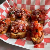 Bruschetta · Chopped tomato, fresh basil, and red onion mixed, with olive oil, Parmesan cheese served on ...