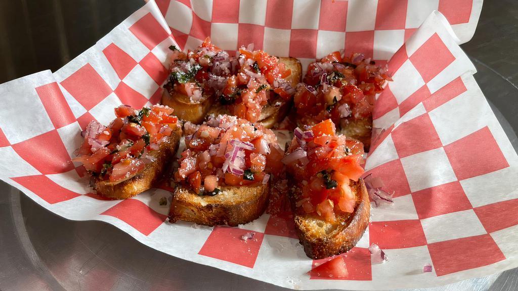Bruschetta · Chopped tomato, fresh basil, and red onion mixed, with olive oil, Parmesan cheese served on fresh baked Italian bread.