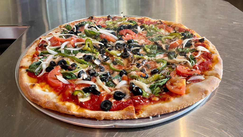 Veggie Supreme Pizza · Mozzarella, green pepper, onion, black olives, mushroom, fresh spinach and Roma tomato.