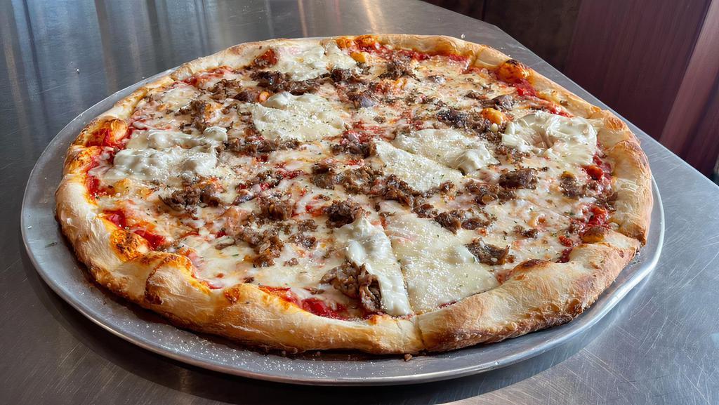 Philly Cheesesteak Pizza · Mozzarella, American cheese, marinated steak and caramelized onion.