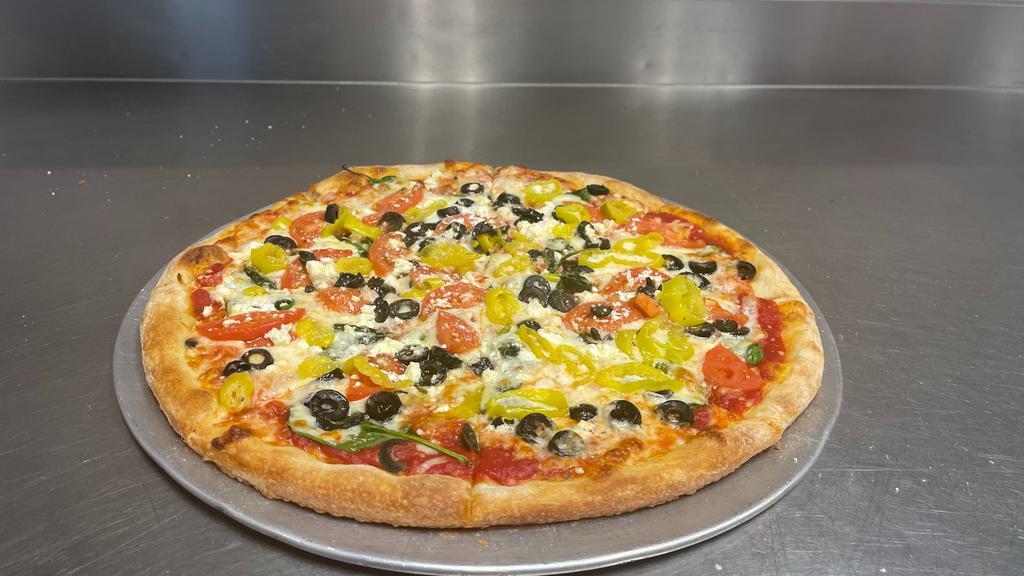 The Greek Pizza · Mozzarella, feta, tomato sauce, fresh spinach, Roma tomato, black olive, banana pepper, and olive oil.