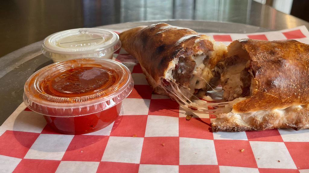 Create Your Own Stromboli · Includes mozzarella and up to 3 toppings. Served with marinara on the side.
