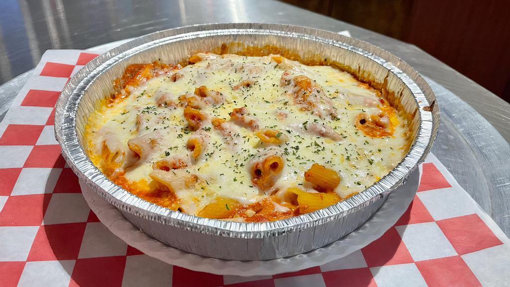 Baked Ziti · Penne pasta tossed in ricotta, Romano and homemade marinara, then baked with mozzarella cheese. Served with garlic bread.