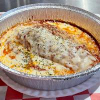 Homemade Meat Lasagna · Layers of tender lasagna noodles, seasoned ground beef, homemade marinara, mozzarella, and R...