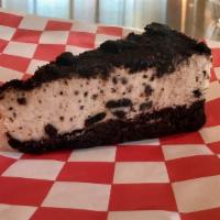 Oreo Mousse Cake · Rich and creamy chocolate mousse cake covered in oreos.