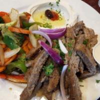 Gyro Plate · Favorite. Thinly sliced beef and lamb served with tahini sauce. Served with choice of two si...