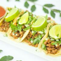 Street Tacos · Small soft tortillas with choice of filling, topped with cilantro and onion. Served with hot...