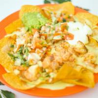 Nachos De Camaron · Toasted chips topped with melted cheese, grilled shrimp, pico de gallo, sour cream and guaca...
